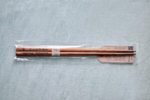 a pair of chopsticks with Japanese Melbourne mark and greetings